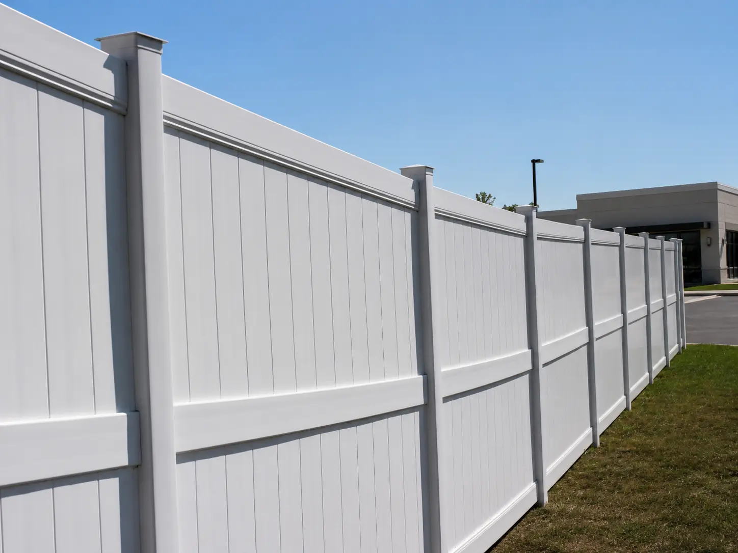 Commercial 8-foot vinyl privacy fence installed by Fred's Fence in New Jersey