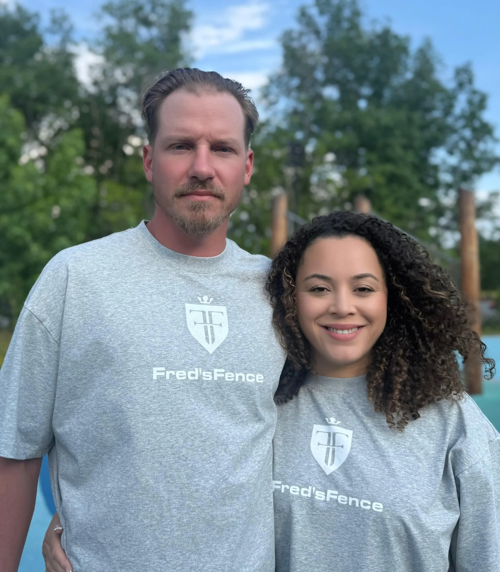 Al and Casandra, owners of Fred's Fence in New Jersey, wearing Fred's Fence branded shirts